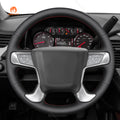 MEWANT black pu leather cover with red stitching installed on a compatible GMC Sierra or Yukon steering wheel